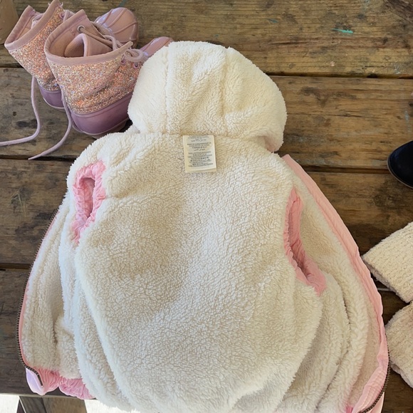 Puffer Vest. Light pink shell/fleece. Infants size 12 months or up to 25lbs. - Picture 2 of 2